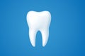 Healthy white tooth isolated on a vibrant blue background Royalty Free Stock Photo