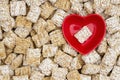 Healthy whole grain cereal background with a heart bowl Royalty Free Stock Photo