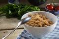 Healthy whole grain pasta, cooked spiral noodles from whole grain spelt in a bowl on a rustic wooden table Royalty Free Stock Photo