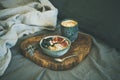 Rice coconut porridge with figs, berries and hazelnuts and coffee