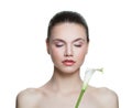 Healthy woman with clear skin and lily flower isolated on white. Spa beauty portrait Royalty Free Stock Photo