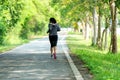 Healthy woman jogging run and workout on road outdoor. Asian runner people exercise gym with fitness session,