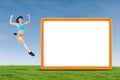 Healthy woman jumping next to copyspace Royalty Free Stock Photo