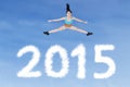 Healthy woman jumping over numbers 2015 Royalty Free Stock Photo