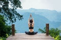 Healthy woman lifestyle balanced practicing meditate and zen energy yoga outdoors on the bridge in morning the mountain nature Royalty Free Stock Photo