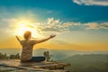 Healthy woman lifestyle balanced practicing meditate and zen energy yoga outdoors on the bridge in morning the mountain nature. Royalty Free Stock Photo