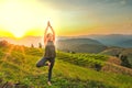 Healthy woman lifestyle balanced practicing meditate and zen energy yoga outdoors on the bridge in morning the mountain nature. Royalty Free Stock Photo