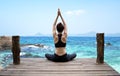 Healthy woman lifestyle exercising vital meditate and practicing yoga at seashore, nature background