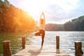 Healthy woman practicing yoga on the bridge Royalty Free Stock Photo