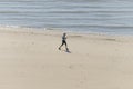 Healthy woman running on the beach