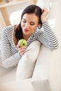 Healthy woman snacking green fruit Royalty Free Stock Photo