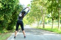 Healthy woman warming up stretching her arms. Asian runner woman workout before fitness and jogging