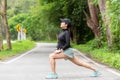 Healthy woman warming up stretching her arms. Asian runner woman workout before fitness and jogging session Royalty Free Stock Photo