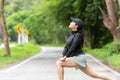 Healthy woman warming up stretching her arms. Asian runner woman workout before fitness Royalty Free Stock Photo