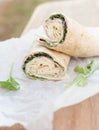 A healthy wrap with turkey, greens and cheese made