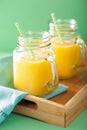 Healthy yellow smoothie with mango pineapple banana in mason jar Royalty Free Stock Photo