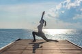 Healthy Yoga woman lifestyle balanced practicing meditate and energy yoga on the bridge in morning and sunrise outdoors nature Royalty Free Stock Photo