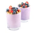 Healthy yogurt breakfast smoothie, dessert decorated with blueberries, strawberries and honey roasted cereal oat chunks Royalty Free Stock Photo