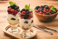 Healthy yogurt dessert with muesli, raspberries and blackberries.