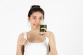 Healthy young Asian woman drinking green detox vegetable smoothie over white isolated background. Vegetarian drink juice, Healthy Royalty Free Stock Photo