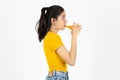 Healthy young Asian woman drinking orange juice over white isolated background. Lifestyle, Diet, Healthy and clean food concept Royalty Free Stock Photo