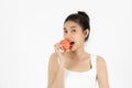 Healthy young Asian woman eating fresh apple over white isolated background. Vegetarian, Healthy lifestyle, Fitness and health Royalty Free Stock Photo