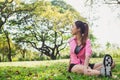 Healthy young asian woman exercising at park. Fit young woman doing training workout in morning.