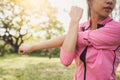 Fit young woman doing training workout in morning. Young happy asian woman stretching at the park after a running workout. Royalty Free Stock Photo