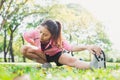 Healthy young asian woman exercising at park. Fit young woman doing training workout in morning. Royalty Free Stock Photo