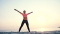 Healthy, young beautiful woman meditating, stretching, practicing yoga on the sea beach, at sunrise, Makes exercises for Royalty Free Stock Photo