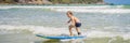 Healthy young boy learning to surf in the sea or ocean BANNER, LONG FORMAT Royalty Free Stock Photo