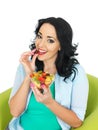 Healthy Young Fresh Faced Woman Holding a Fresh Bowl of Mixed Exotic Fruit Salad Royalty Free Stock Photo