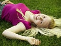 Healthy young girl laying on the grass Royalty Free Stock Photo