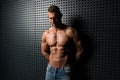 Portrait of Muscular Man Standing Near the Wall Royalty Free Stock Photo