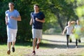 healthy young people running on mountain trail in morning Royalty Free Stock Photo