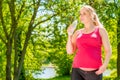 Healthy young pregnant girl with a bottle of mineral water Royalty Free Stock Photo