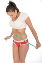 Healthy Young Woman Checking Her Weight Loss With a Tape Measure Royalty Free Stock Photo