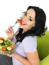 Healthy Young Woman Eating a Fresh Crisp Mixed Garden Salad Royalty Free Stock Photo