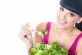 Healthy Young Woman Eating Fresh Salad Leaves with Tomato Royalty Free Stock Photo