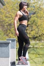 Healthy Young Woman Flexing Muscles Outdoors Royalty Free Stock Photo