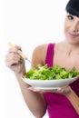 Healthy Young Woman Holding a Bowl of Fresh Green Salad Leaves Royalty Free Stock Photo