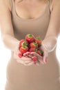 Healthy Young Woman Holding a Handful of Strawberries Royalty Free Stock Photo