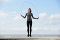 Healthy young woman with jump rope Royalty Free Stock Photo