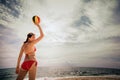 Healthy young woman laughing with beach ball while on the beach in summer Royalty Free Stock Photo