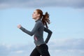 Healthy young woman running outdoors Royalty Free Stock Photo