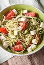 Healthy zucchini pasta with cheese and tomato close up vertical Royalty Free Stock Photo