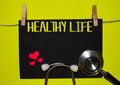 HEALTY LIFE on top of yellow background. Medical