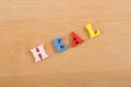 HEALword on wooden background composed from colorful abc alphabet block wooden letters, copy space for ad text. Learning english Royalty Free Stock Photo