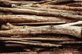 Heap of aged brown wooden logs