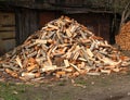 The heap of alder firewood lies in the yard